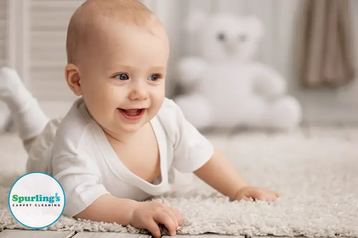 Carpet cleaning Victor NY: baby crawling on clean white carpet