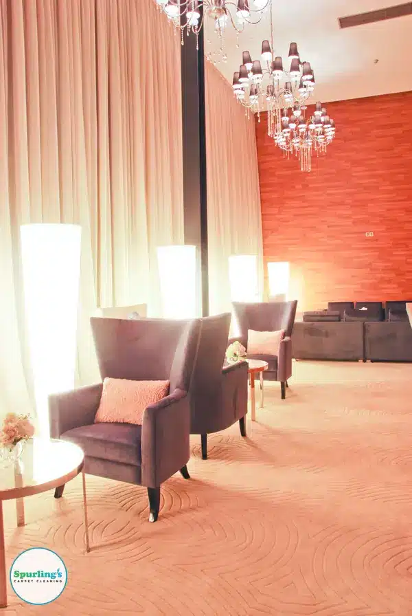 Commercial carpet and upholstery cleaning: upholstered armchairs on patterned carpet in a lounge